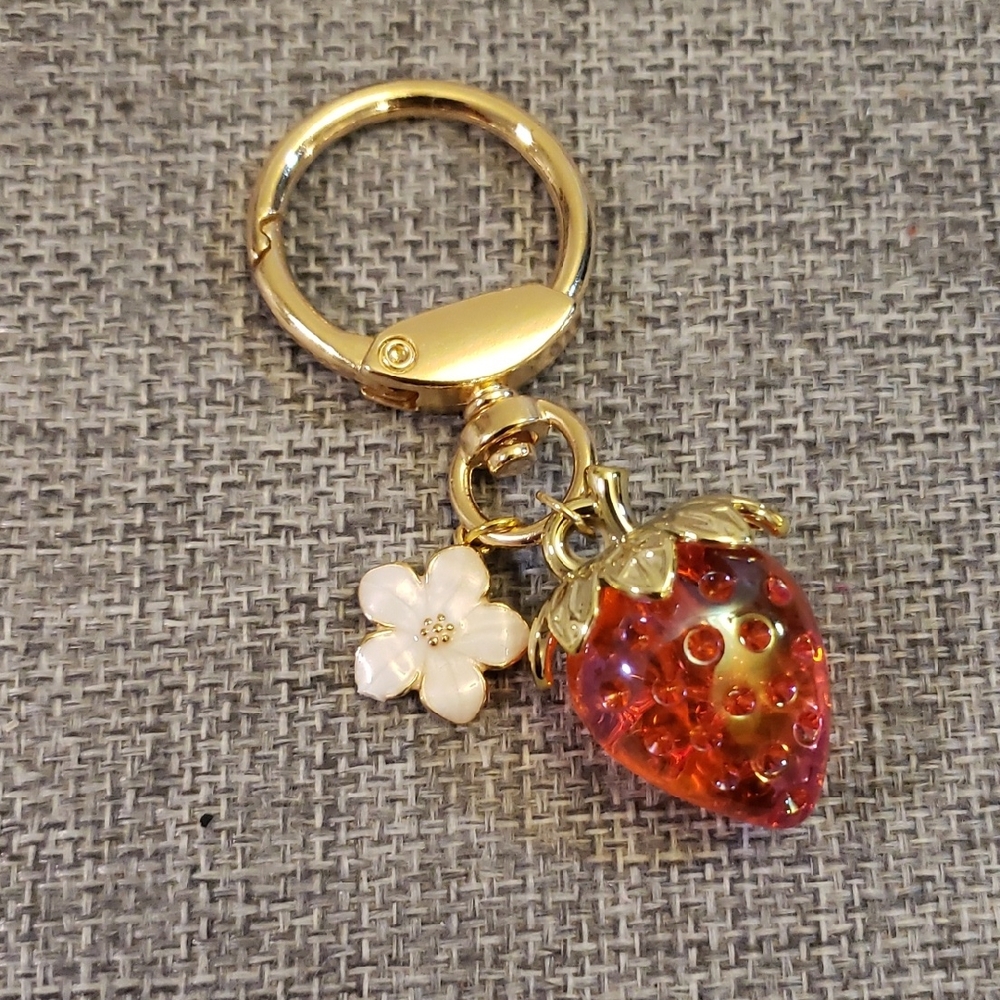 Gold and Red Strawberry Bag Charm With White Flower
